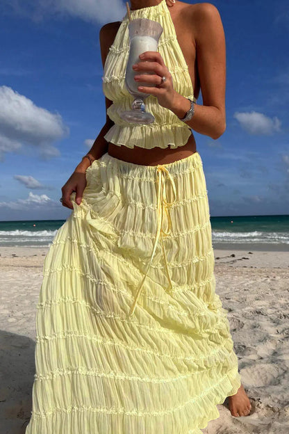 Conjunto DENIS, top cuello halter, falda larga.