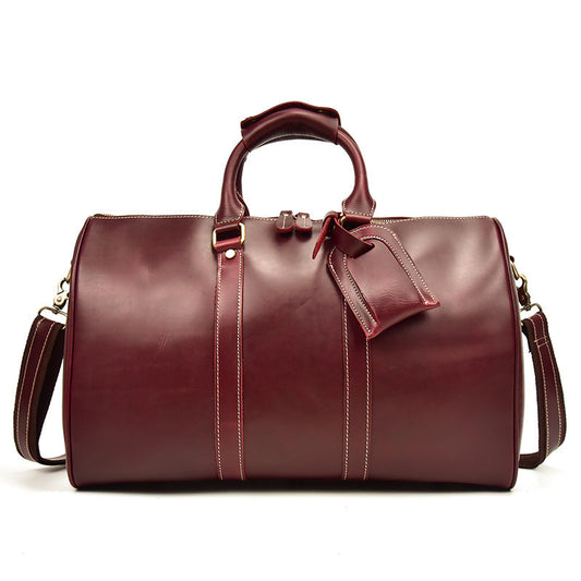 Bolso CHICAGO de viaje de piel color rojo vino con correa para el hombro.