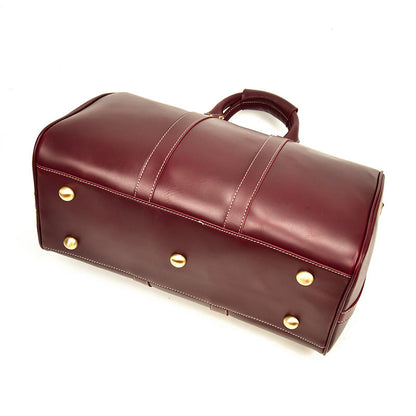 Bolso CHICAGO de viaje de piel color rojo vino con correa para el hombro.