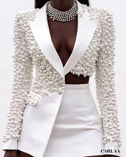 Conjunto Ziria tendencia 2026, dos piezas de perlas empalmadas para mujer, solapa, manga larga, top Irregular, minifalda de cintura alta, traje para mujer, nuevo