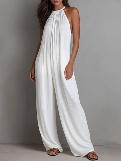Mono Magdalena, plisado con escote halter y pierna ancha.