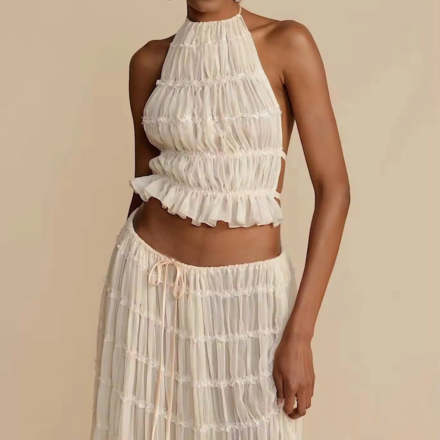 Conjunto DENIS, top cuello halter, falda larga.