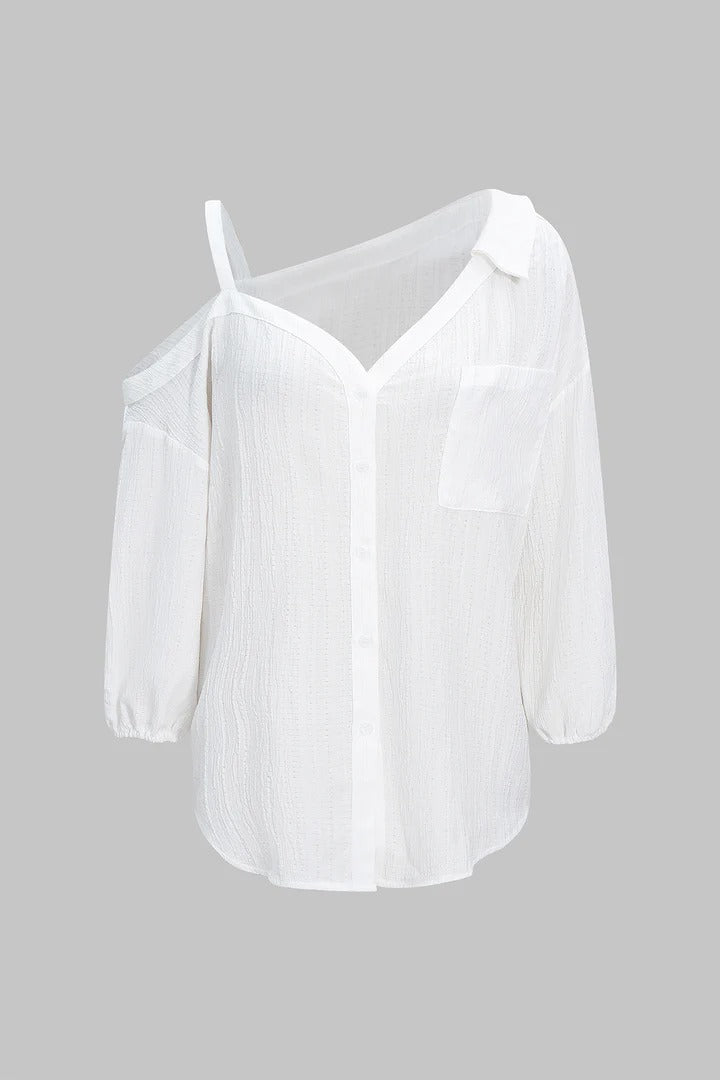 Camisa CASANDRA asimétrica de manga larga sin espalda con botones.