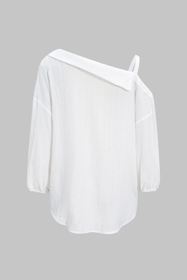 Camisa CASANDRA asimétrica de manga larga sin espalda con botones.