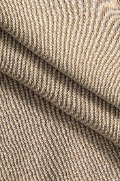 Conjunto ATELIER de top corto de punto abotonado y falda larga.