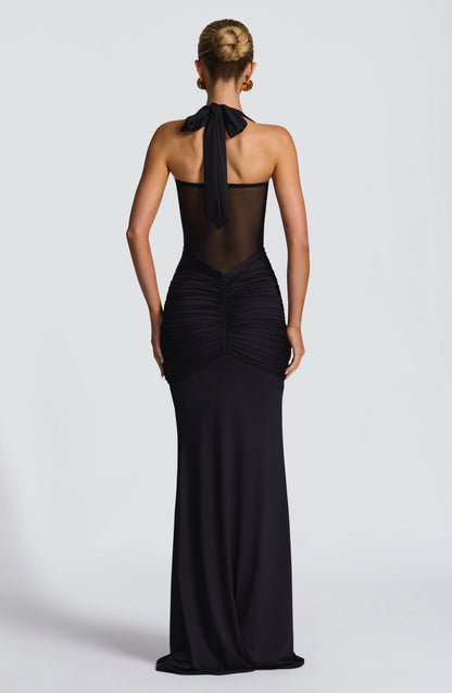 Vestido ICÓNICA, con transparencias y espalda con lazo ajustable.
