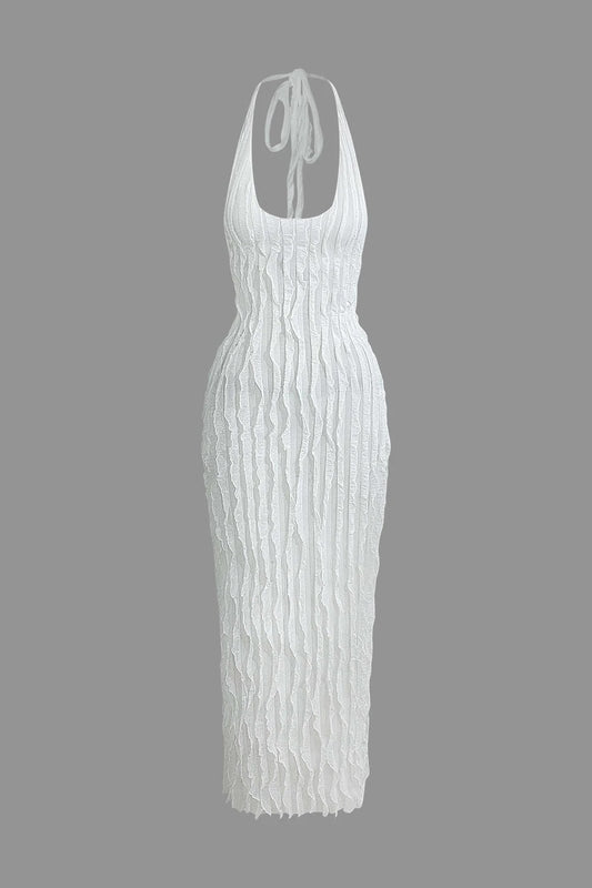 Vestido Maria largo sin espalda con escote halter y textura de volantes transparentes.