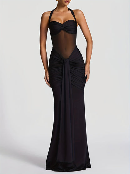 Vestido ICÓNICA, con transparencias y espalda con lazo ajustable.