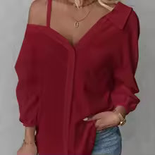 Camisa CASANDRA asimétrica de manga larga sin espalda con botones.