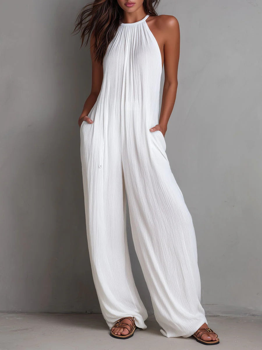 Mono Magdalena, plisado con escote halter y pierna ancha.