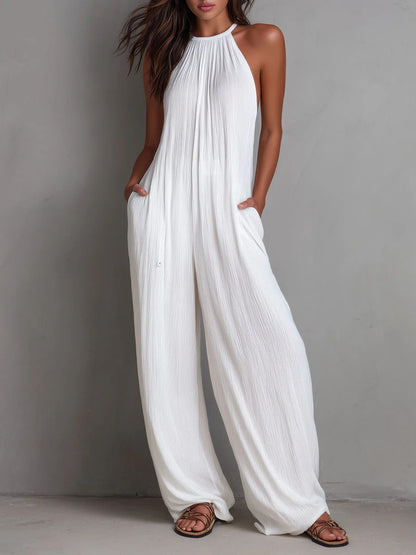 Mono Magdalena, plisado con escote halter y pierna ancha.