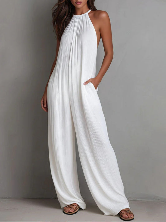 Mono Magdalena, plisado con escote halter y pierna ancha.