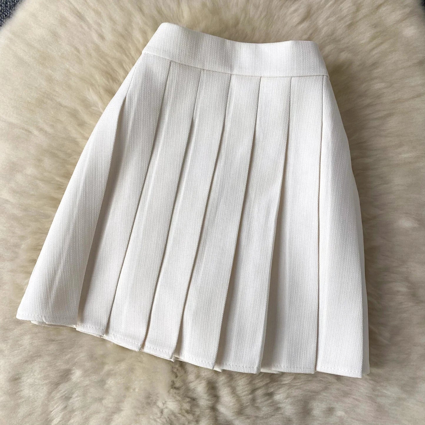 Conjunto POLI de 2 piezas, chaleco y falda.