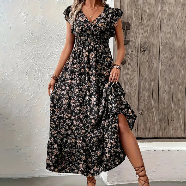 Vestido KIM de verano 2026 con estampado floral, cintura estrecha y falda amplia.