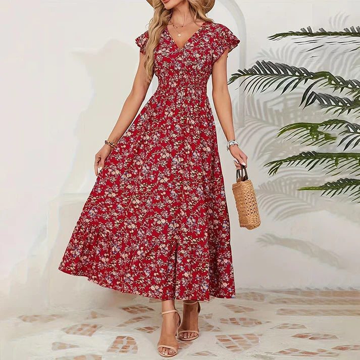 Vestido KIM de verano 2026 con estampado floral, cintura estrecha y falda amplia.