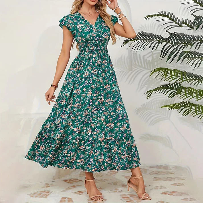 Vestido KIM de verano 2026 con estampado floral, cintura estrecha y falda amplia.