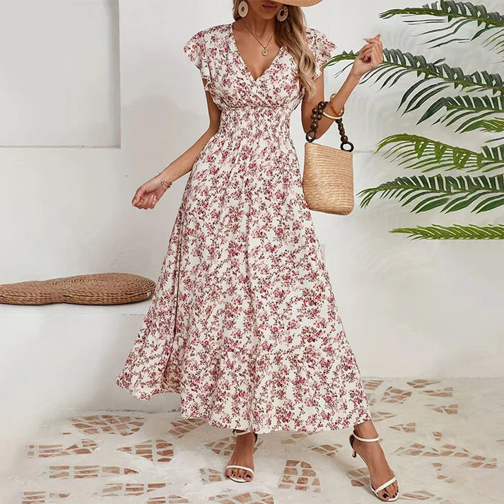Vestido KIM de verano 2026 con estampado floral, cintura estrecha y falda amplia.