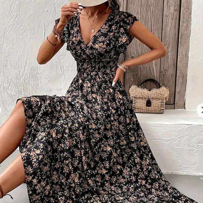 Vestido KIM de verano 2026 con estampado floral, cintura estrecha y falda amplia.