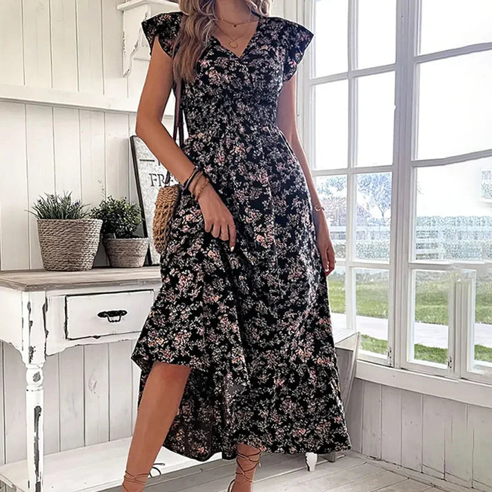 Vestido KIM de verano 2026 con estampado floral, cintura estrecha y falda amplia.