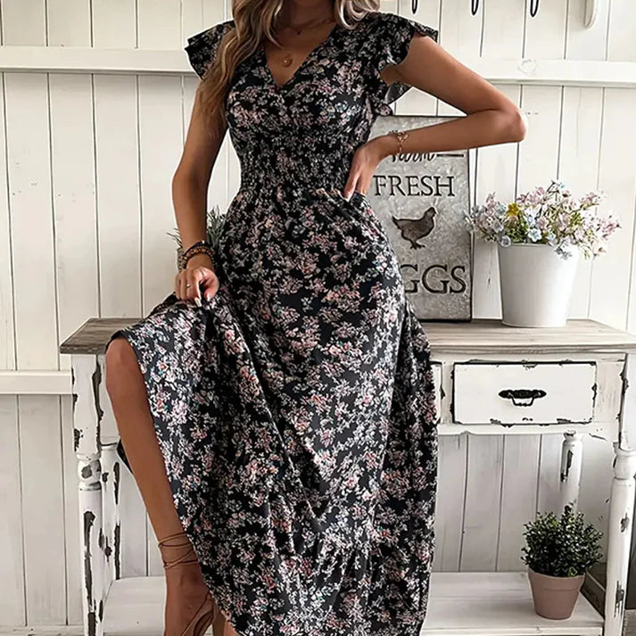 Vestido KIM de verano 2026 con estampado floral, cintura estrecha y falda amplia.