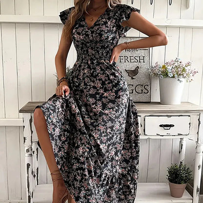 Vestido KIM de verano 2026 con estampado floral, cintura estrecha y falda amplia.
